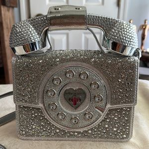 Betsy johnson blue tooth phone purse. Silver. Used once. With instructions.